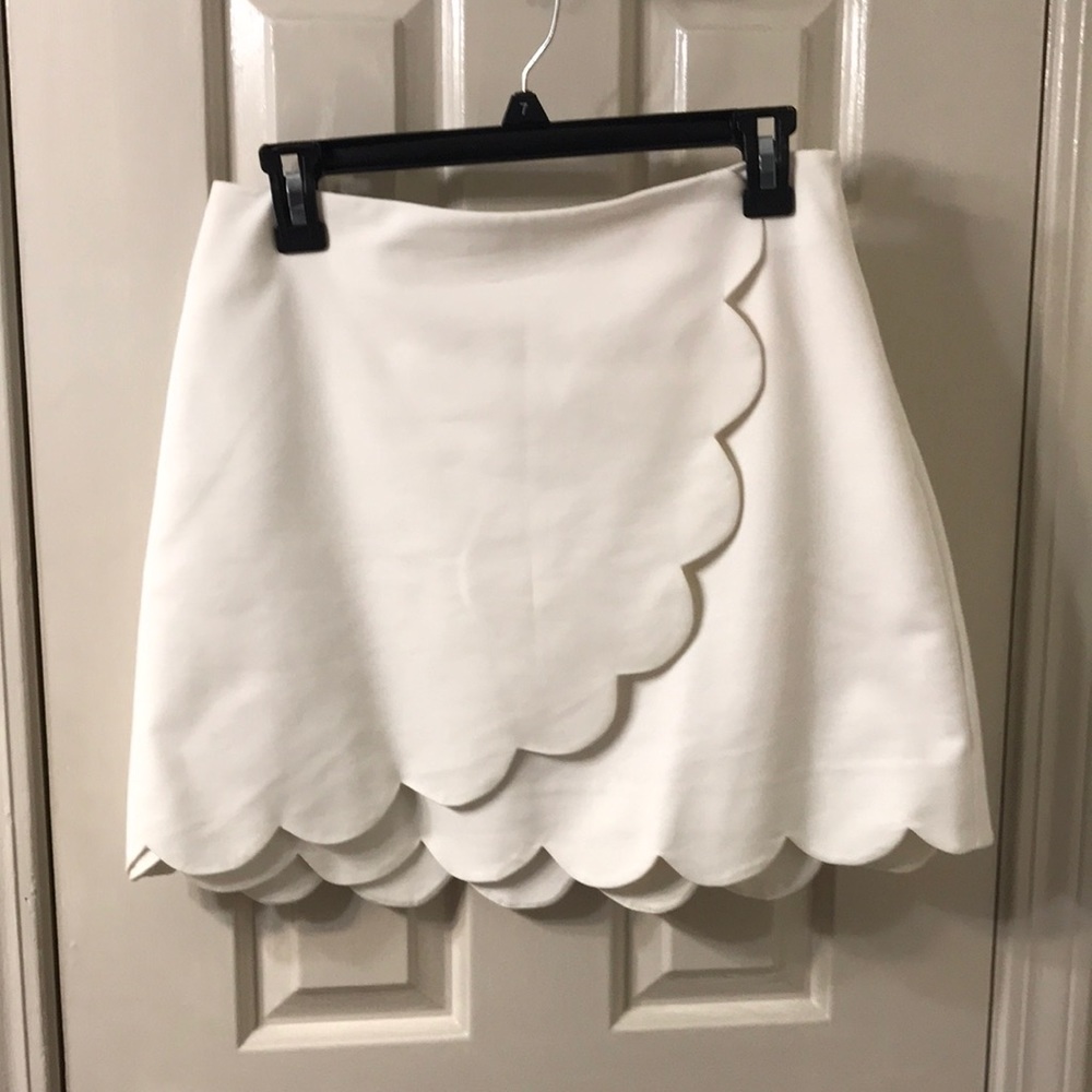 Creamy white faux wrap skirt with scallop edge